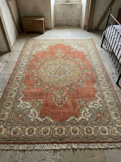 Hand knotted Oushak rug with rust medallion design made from natural wool