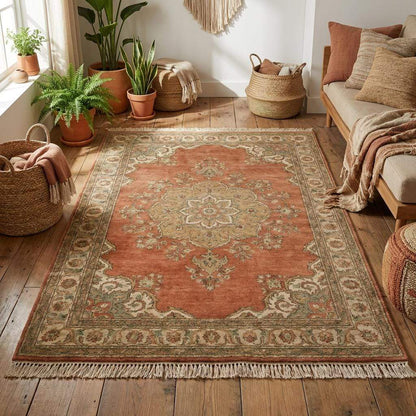 Wool hand knotted area rug featuring central medallion and classic Persian inspired pattern