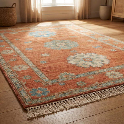 10x12 hand knotted Oushak rug in terracotta rust and blue wool with geometric floral design