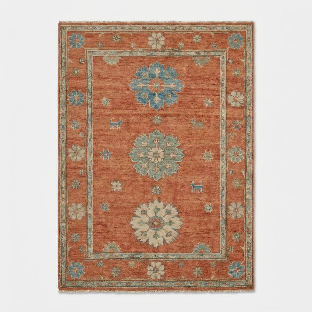 10x12 hand-knotted Oushak rug in terracotta rust and blue wool with geometric floral pattern