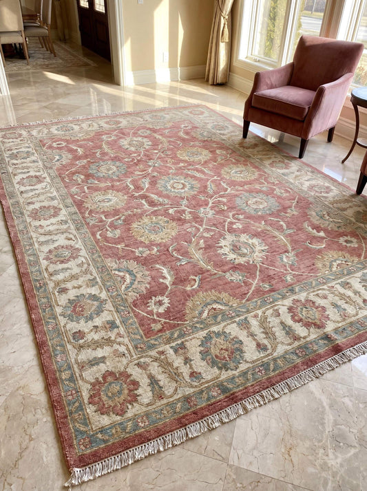 Hand knotted Oushak rug with vintage floral design in dusty rose pink wool for living room decor