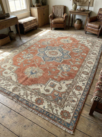 Hand knotted Oushak rug in muted terracotta and blue with vintage medallion design