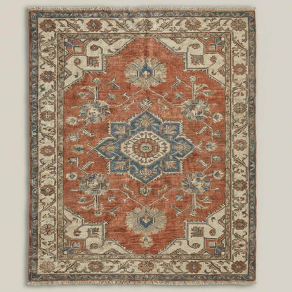 Hand knotted Oushak rug in muted terracotta and blue with vintage medallion design on wool area carpet
