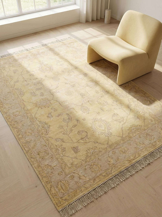 Hand knotted yellow Oushak rug with soft floral vines in a sunlit living room interior __etsy:7708584164
