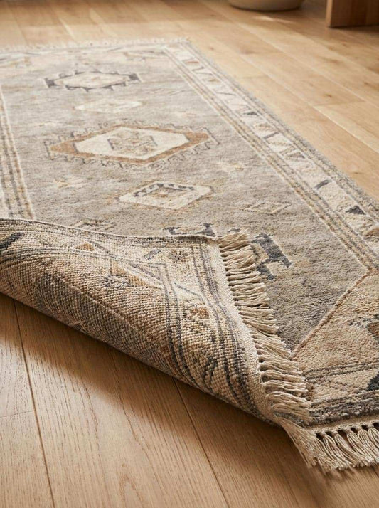 Close-up view of hand knotted wool fibers showing low pile texture, artisan knotting detail, and durable handmade construction __etsy:8091967404