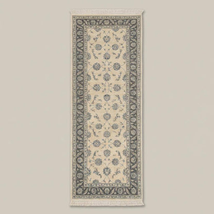 Traditional floral wool runner rug with muted blue border and ivory field