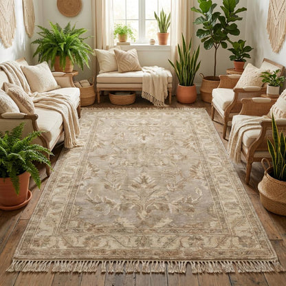 Soft beige handmade wool rug creating calm minimalist interior foundation in sunlit reading corner
