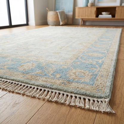 Hand knotted Oushak style wool rug with soft blue vintage floral design, 8x10 and 9x12 sizes