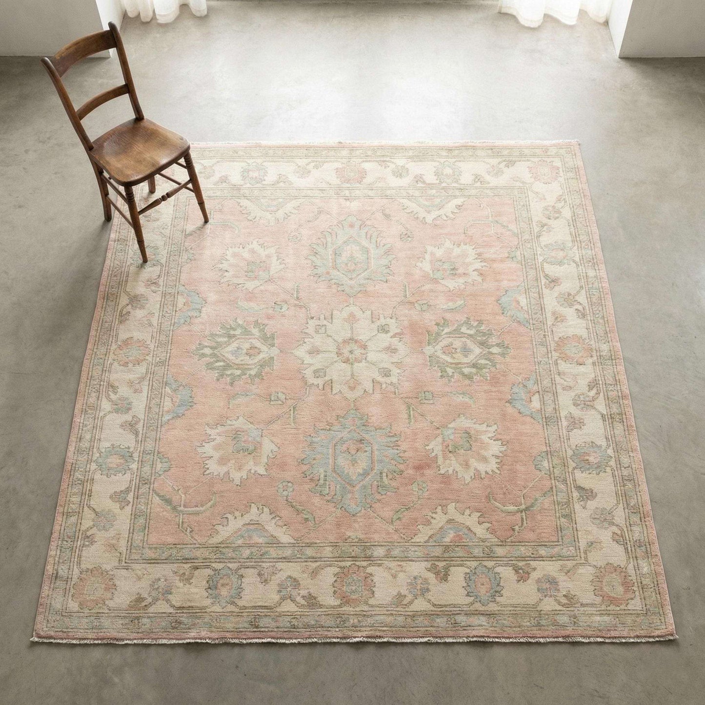 Hand Knotted Oushak Turkish floral wool area rug in soft pastel colors with classic design