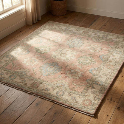 Artisan hand knotted rug craftsmanship showing traditional weaving quality and refined low pile finish.