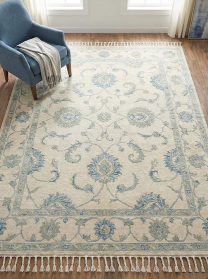 Hand knotted Oushak wool rug in ivory and blue floral design for living room