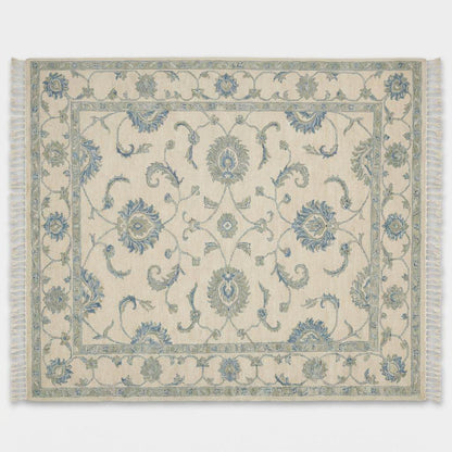 Ivory and blue hand knotted floral rug with traditional Oushak design and decorative border