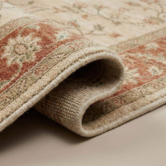 Close-up of hand knotted wool rug showing dense knot structure, natural wool fibers, and soft pile texture