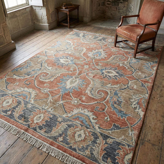 Hand knotted Oushak wool area rug with vintage floral design and warm terracotta tones