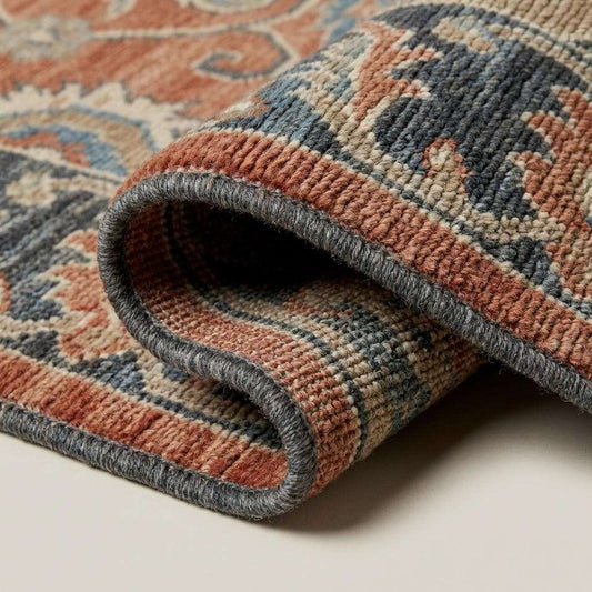 Close-up of hand knotted wool pile showing dense knot structure, natural fibers, and soft texture