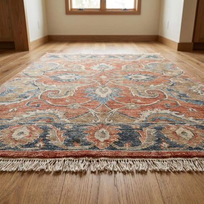 Traditional hand knotted rug with flowing floral design and soft abrash variation
