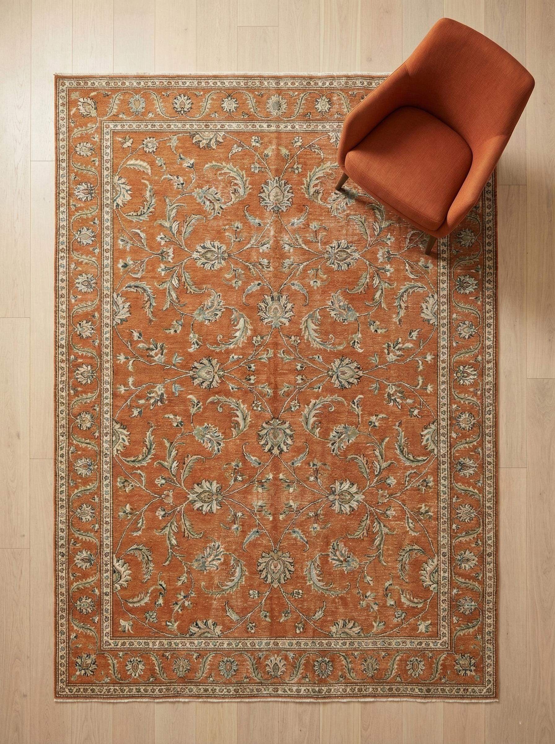 Hand knotted Oushak wool rug with terracotta rust floral design and low-pile finish