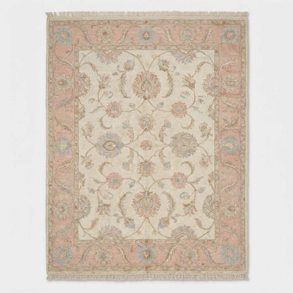 Traditional floral Oushak rug with pastel pink and blue accents on cream background