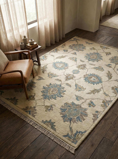 Hand knotted Oushak wool rug with neutral floral design for elegant living rooms and bedrooms