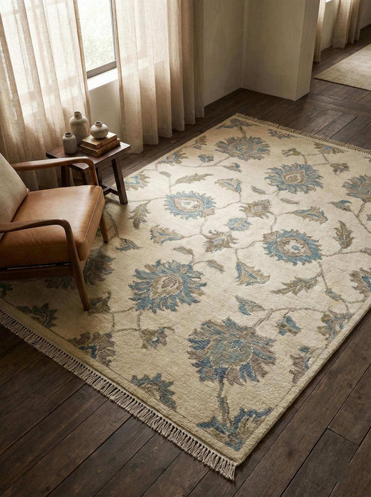 Hand knotted Oushak wool rug with neutral floral design for elegant living rooms and bedrooms