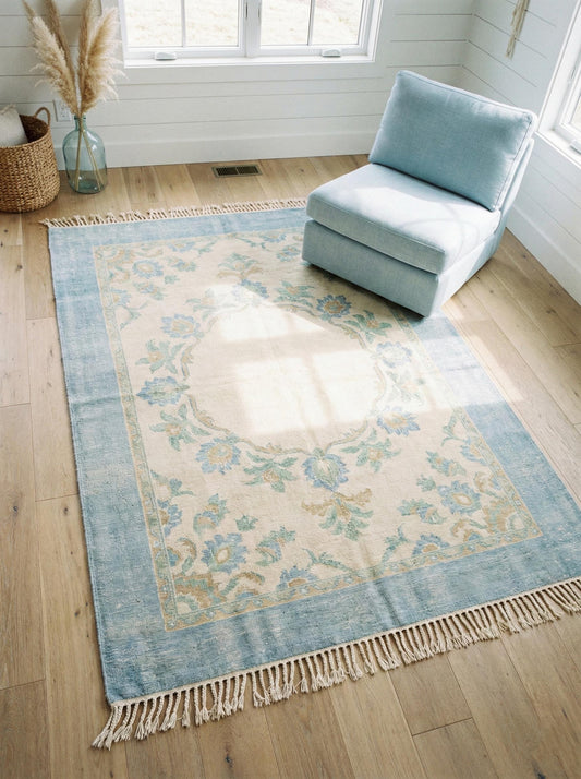Hand knotted Oushak wool rug with light blue floral medallion on ivory background, Turkish style living room carpet