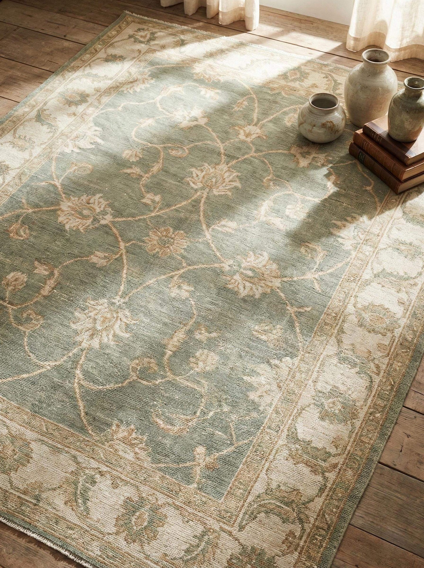 Hand knotted Oushak wool rug with sage green floral design and low pile texture