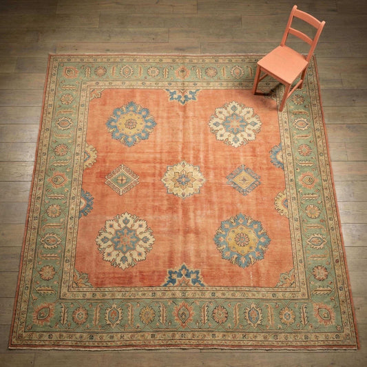11x12 ft hand knotted Oushak wool rug with floral medallion design in peach and sage green for living room