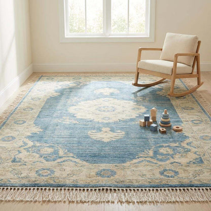 Designer hand knotted wool carpet adding soft antique elegance to contemporary home space