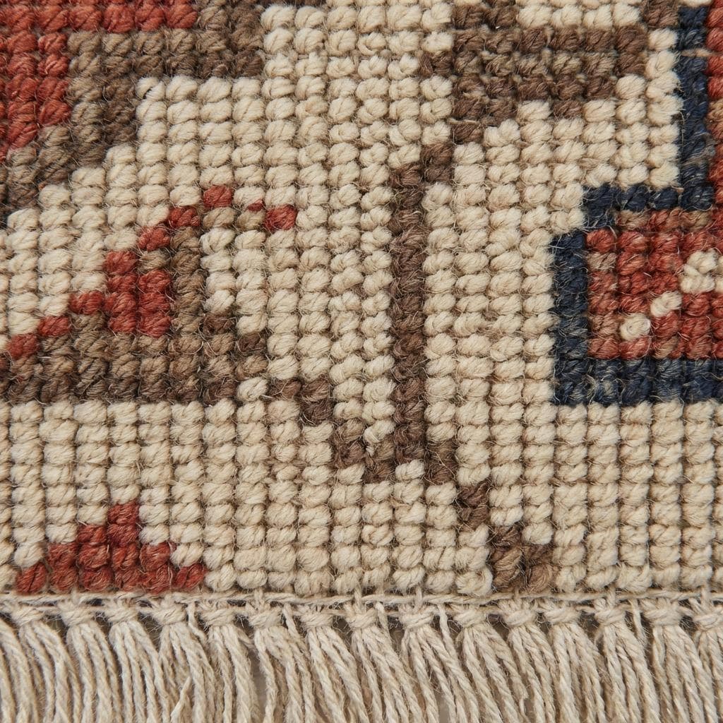 Close-up of hand knotted wool pile showing individual knot texture and natural fibers