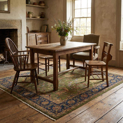 Hand knotted Persian style green wool area rug with deer and floral border