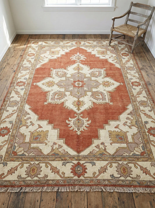 Hand knotted rust wool area rug with terracotta geometric Serapi design.