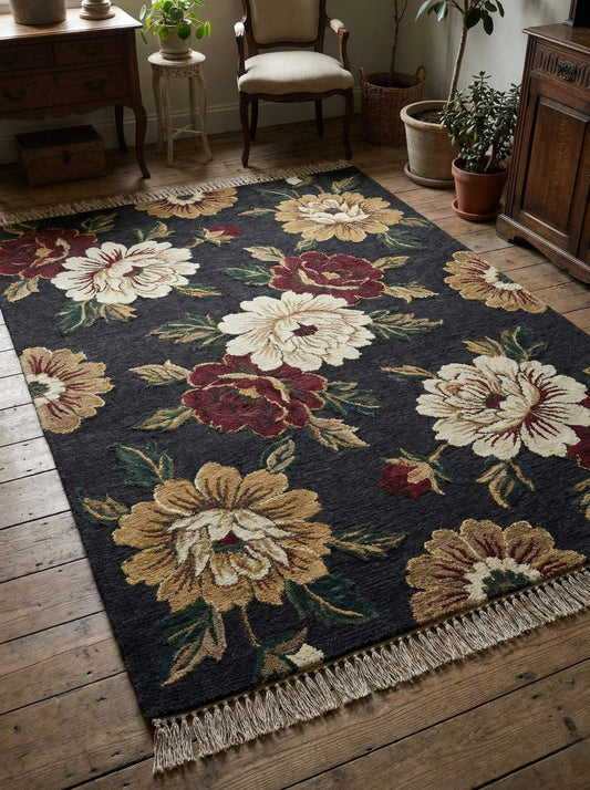 Hand knotted wool rug featuring a bold floral pattern on a dark charcoal black background, placed in a vintage style living room with wooden floors. __etsy:7645741306