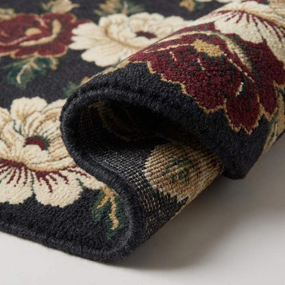 Close up view of hand knotted wool pile texture, showing individual knots and dense weave structure of the cream and burgundy flower petals. __etsy:7645741496