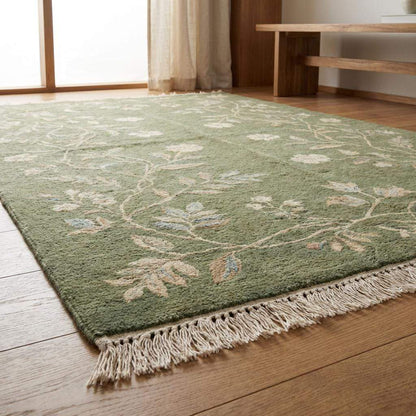 Artisan hand knotted wool rug with all-over floral design and soft sage background