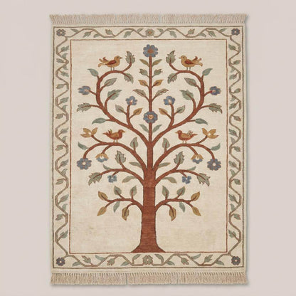 Oushak style floral bird rug with tree motif in beige and rust tones placed on wooden floor near accent chair __etsy:7965657139