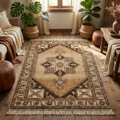 Rustic hand knotted area rug styled in farmhouse living room with wooden floors