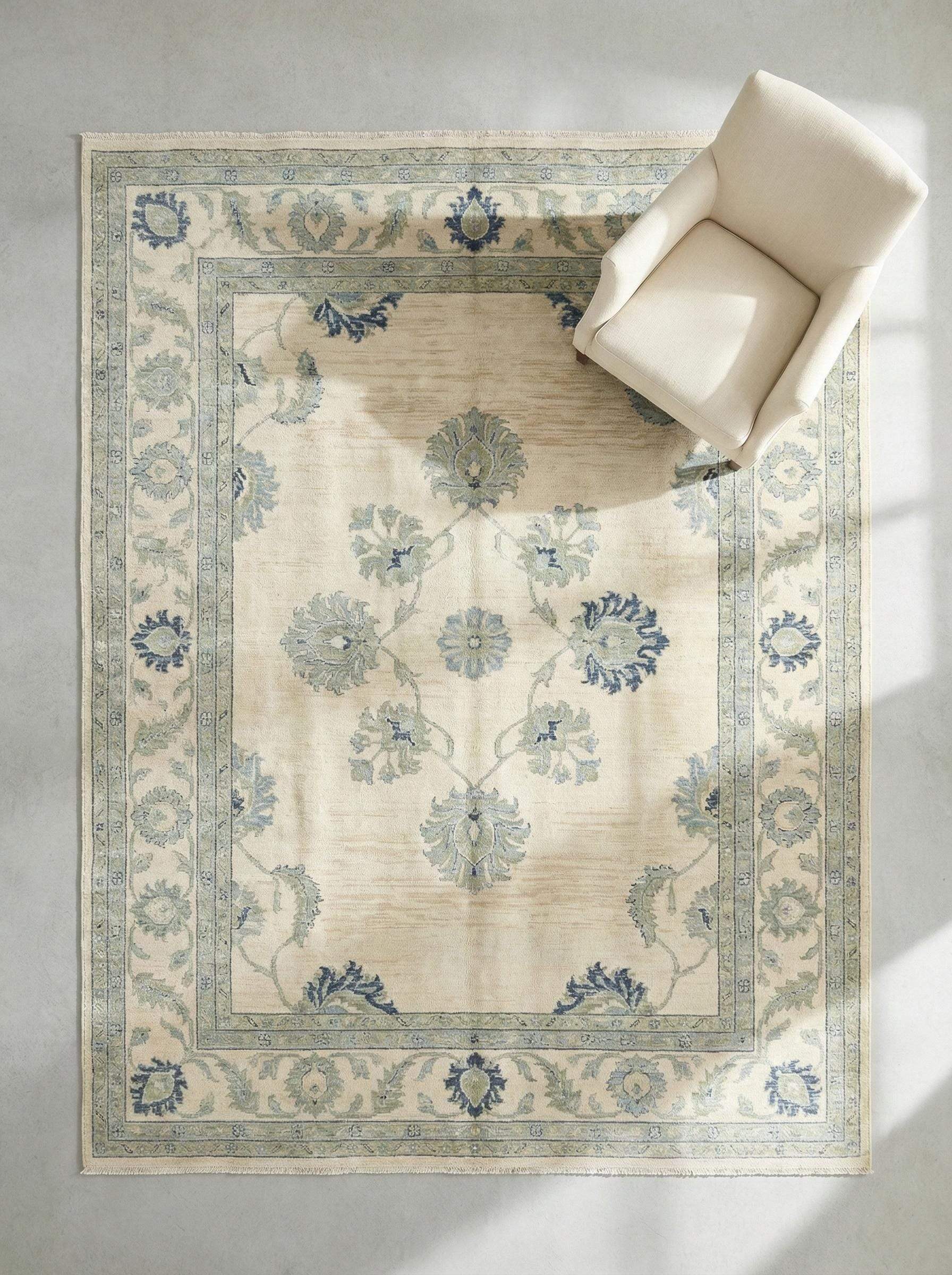 Hand knotted wool Oushak rug with muted blue floral design and vintage botanical motifs
