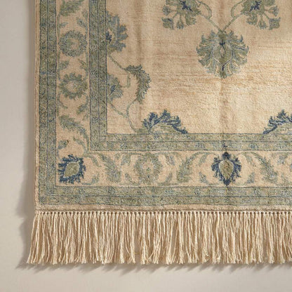 Close up detail showing the dense wool pile and individual knot structure of the artisan handmade rug construction.