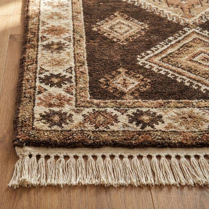 Close-up of hand knotted wool rug showing dense knots, natural wool fibers, and textured pile