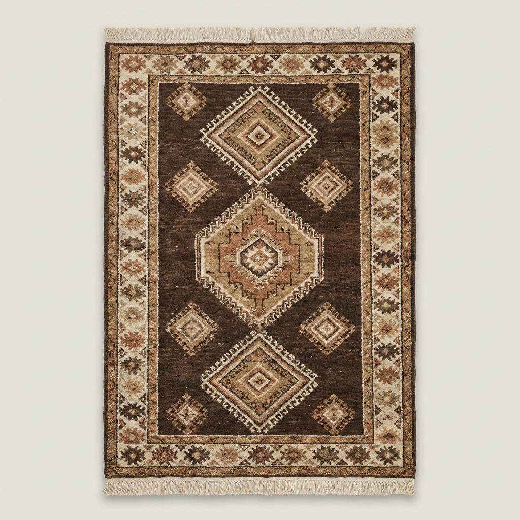 Traditional hand knotted wool rug with geometric diamond motifs and earthy tones