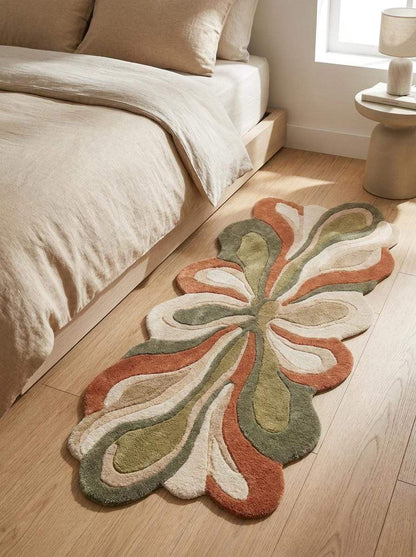 Hand tufted irregular shaped abstract floral wool rug runner in sage green and rust for modern hallway decor