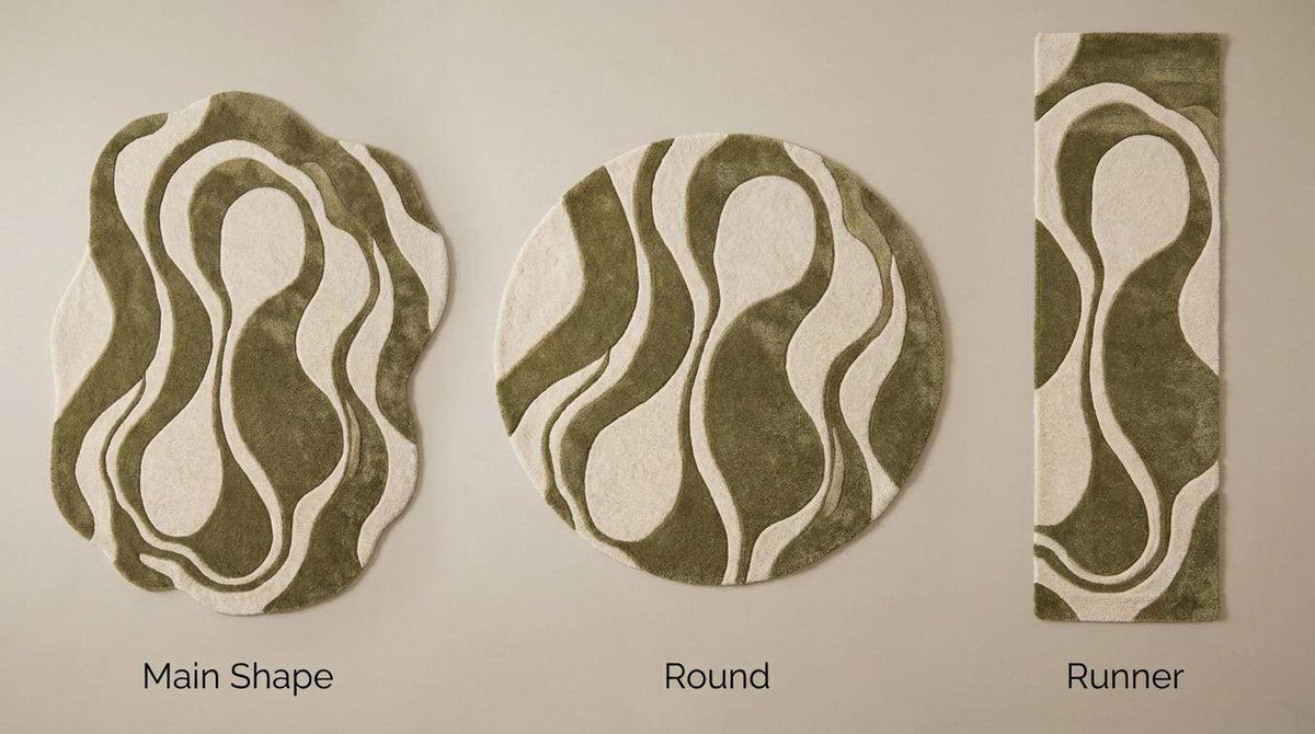 Hand tufted abstract rug with organic green and cream shapes for modern living room decor