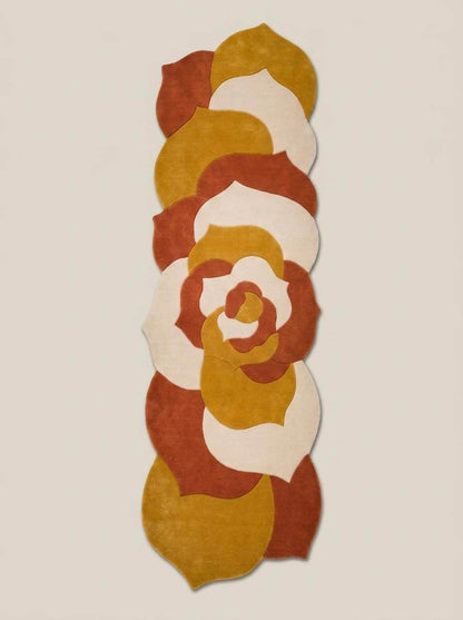 Hand tufted abstract floral runner rug in mustard yellow and burnt orange with irregular shape for modern hallway decor