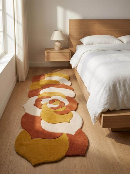 Hand tufted abstract floral runner rug in mustard yellow and burnt orange with irregular shape for modern hallway decor