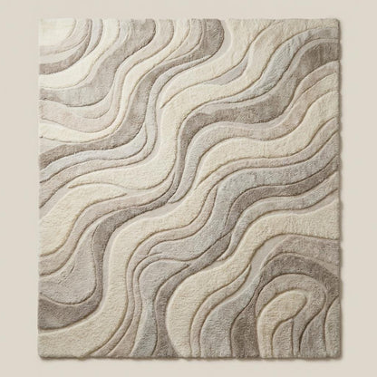 Contemporary neutral area rug with flowing organic pattern styled beside mid-century wooden furniture.