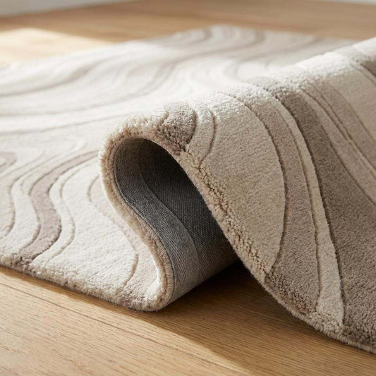 Close-up view of hand tufted wool fibers showing sculpted cut pile texture, premium wool construction, and dimensional wave detailing. __etsy:8091705570