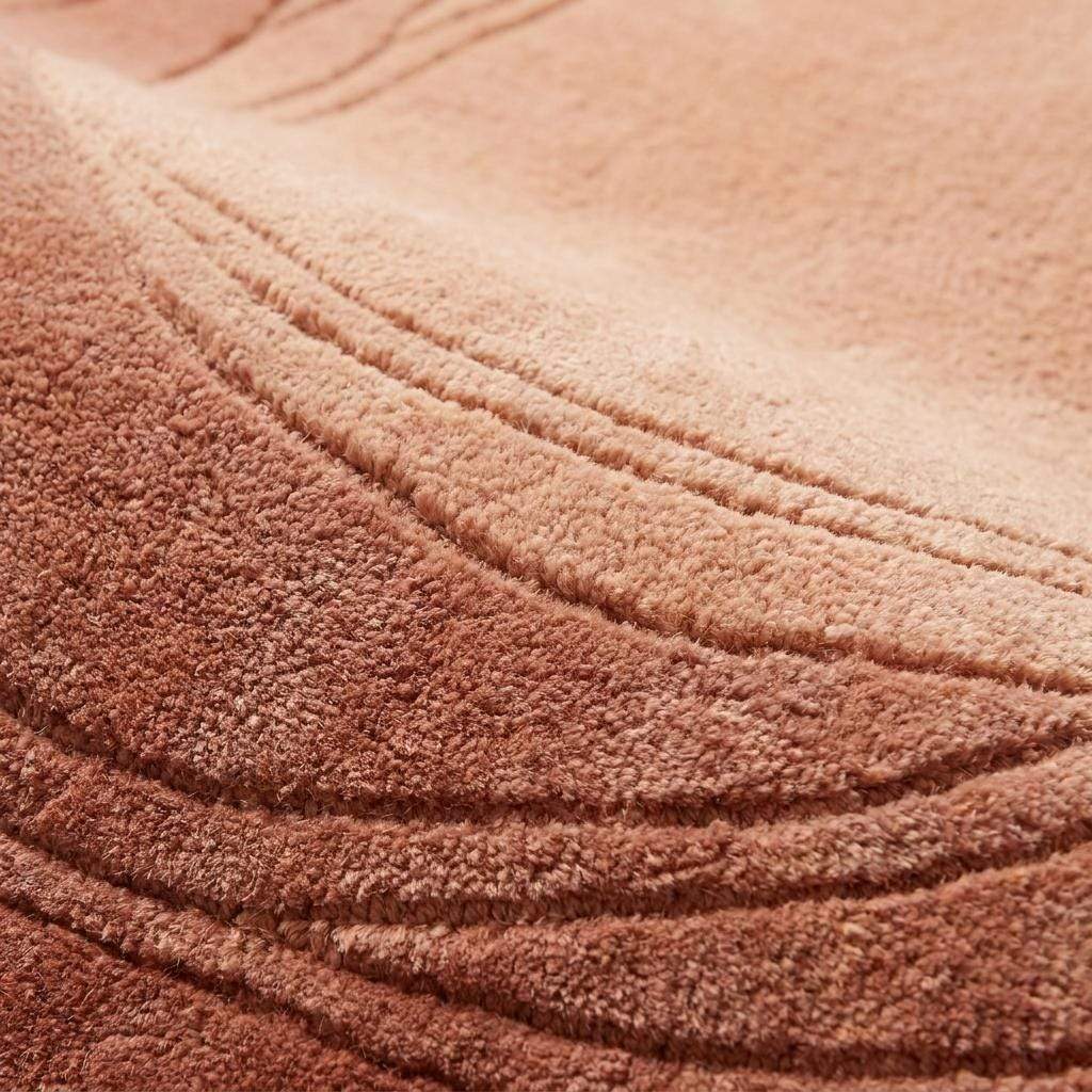 Close-up of hand tufted wool rug texture showing dense cut pile, carved contour lines, and soft premium wool fibers __etsy:8007287530