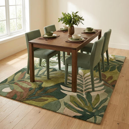 Modern tropical leaf area rug in shades of sage, forest green, and ivory wool pile