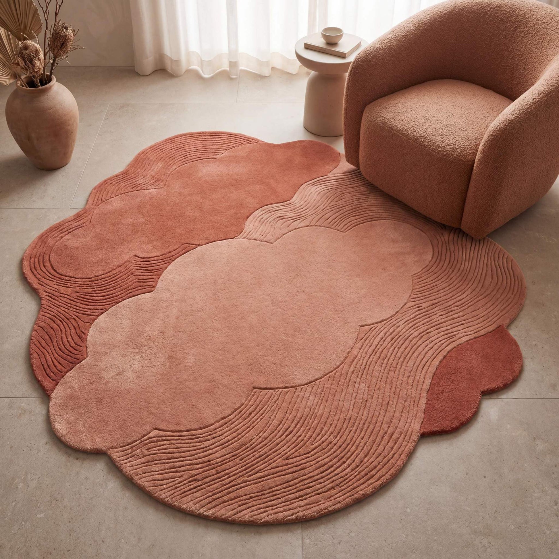 Hand tufted cloud shape rug in dusty pink and terracotta tones styled in a modern minimalist living room __etsy:8053847539