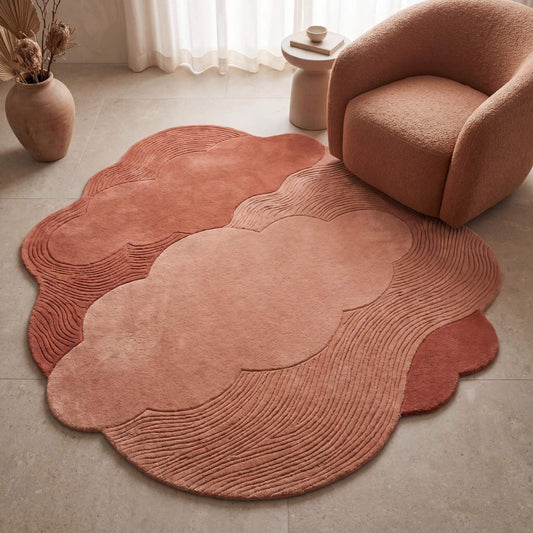 Hand tufted cloud shape rug in dusty pink and terracotta tones styled in a modern minimalist living room __etsy:8053847539
